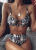Eleganckie bikini damskie z wysokim stanem i ozdobnym metalowym pierścieniem. Regulowane ramiączka, modne wzory: czarny, panterka i skóra węża. Rozmiary S-L. Idealne na plażę i basen.